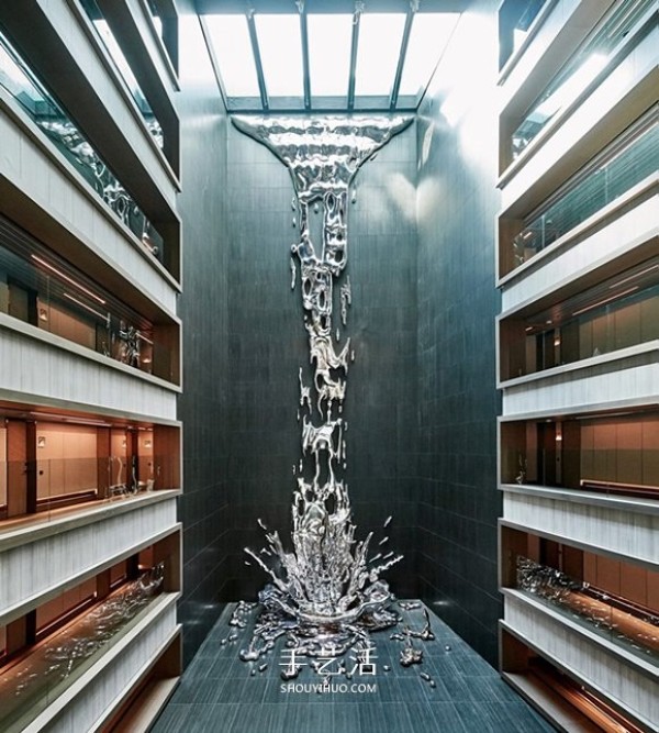 A 12-story metal waterfall sculpture pouring down