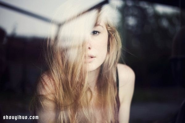 The girls reflection through the glass window takes a dreamy and beautiful photo