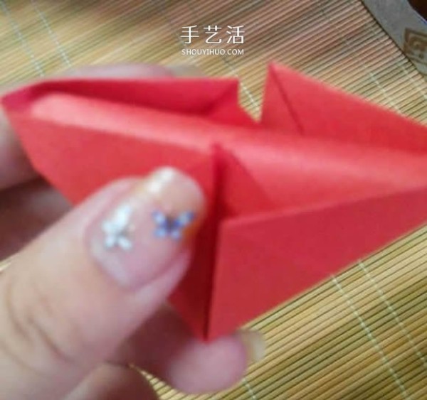 Illustration of the origami method of a lotus that is about to fully bloom