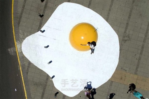 Huge poached eggs! 3 meters wide and 1.5 meters high egg installation art