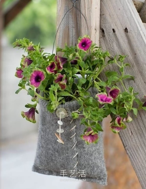 Repurpose an old sweater and use DIY to make a beautiful hanging flower pot bag! 