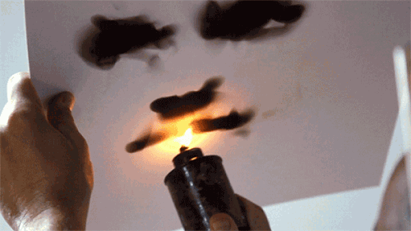 Patricks fire paintings uses candles to create fake ink paintings