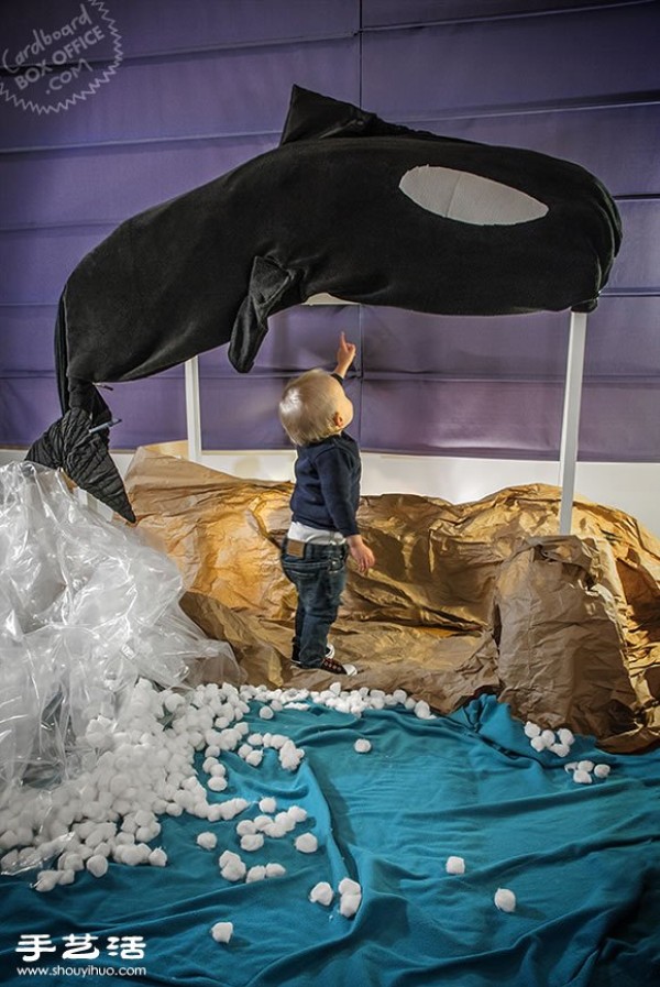 The role-playing time of a family of three in a homemade movie scene from a cardboard box