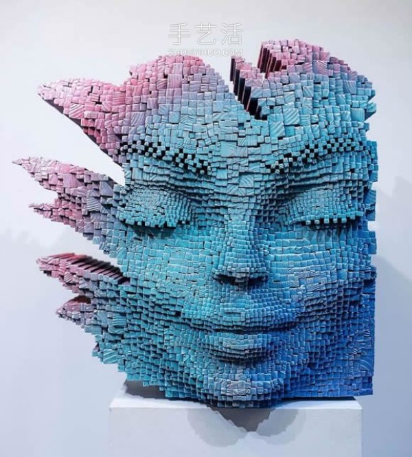 Vibrant pixelated wood carvings show the depth of the human soul