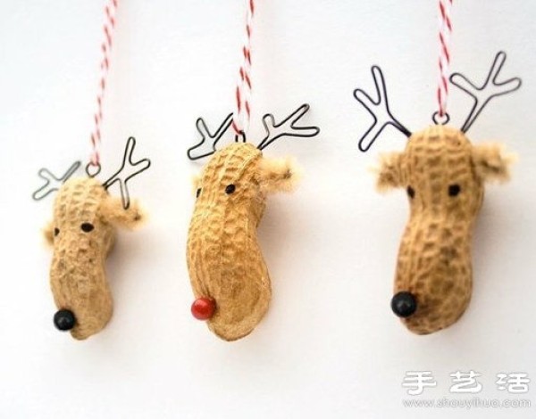 DIY sika deer pendant made from peanut shells and thumbtacks