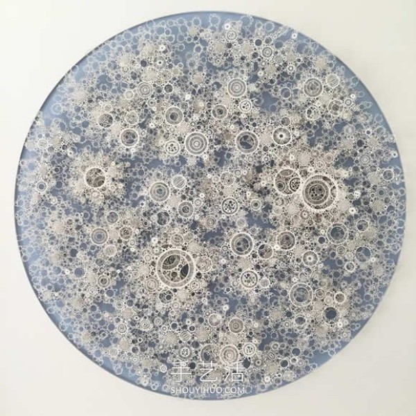 Intricate hand-cut paper sculptures that mimic microorganisms