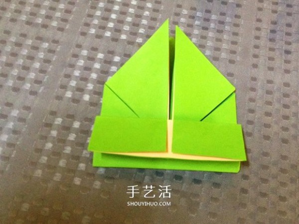 Detailed step-by-step illustration of a simple origami frog