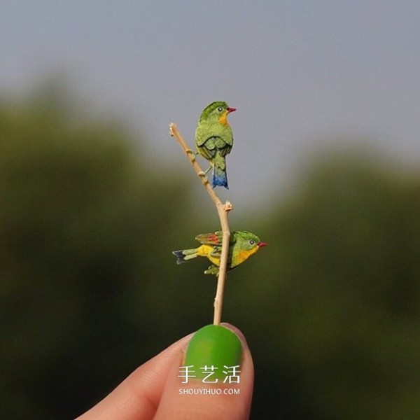 365 days of persistence! Cut paper to create miniature lovebirds and orioles...