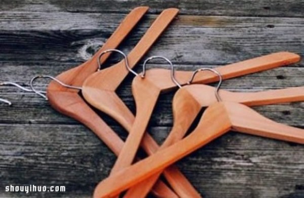 Wooden clothes hanger is handmade and transformed into a DIY super practical coat rack