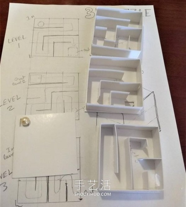 Detailed illustration of the method of rolling beads in a homemade maze toy box