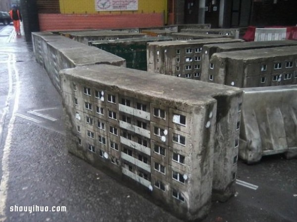 The cement piers and electrical boxes are transformed into houses with mini buildings and graffiti to beautify the environment