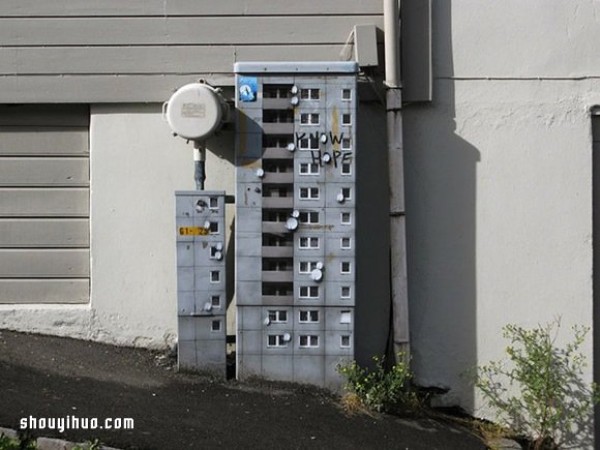 The cement piers and electrical boxes are transformed into houses with mini buildings and graffiti to beautify the environment