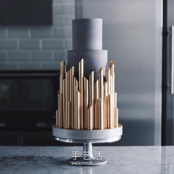 Towering creative cake that looks like an avant-garde sculpture in a museum