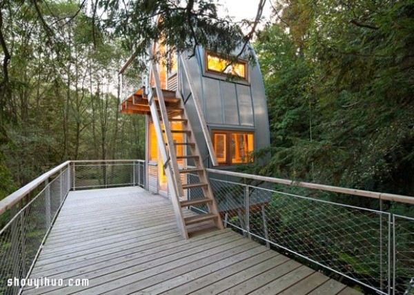 An old thatched hut transformed into a strange tree house standing in a lake