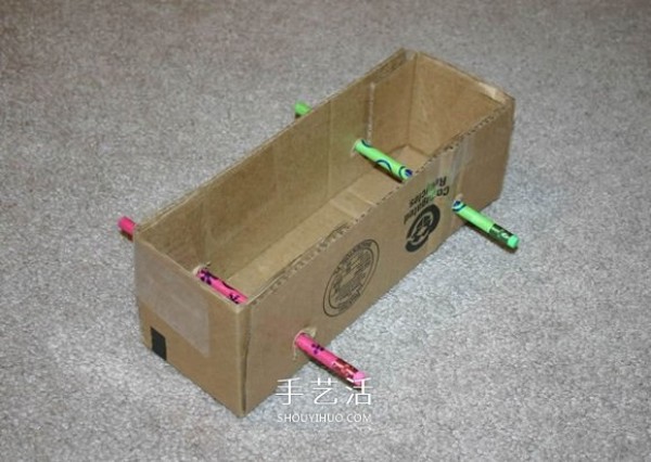 How to make a rubber band powered car by hand using cardboard boxes