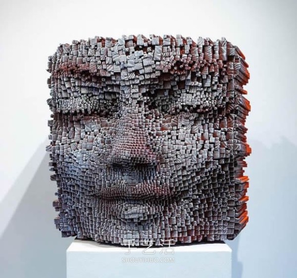 Vibrant pixelated wood carvings show the depth of the human soul