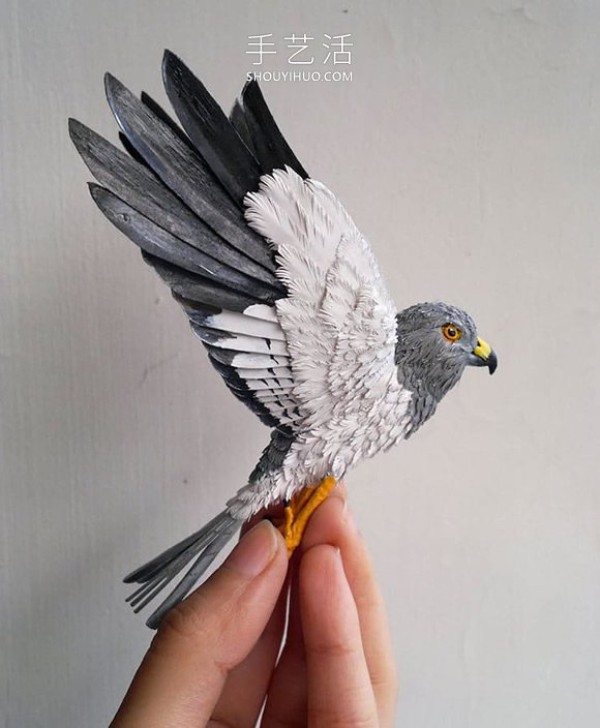 Realistic paper bird sculpture that looks like a photo