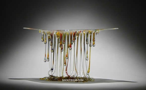 The dripping stained glass sculpture transforms into a jellyfish-like splendid gesture