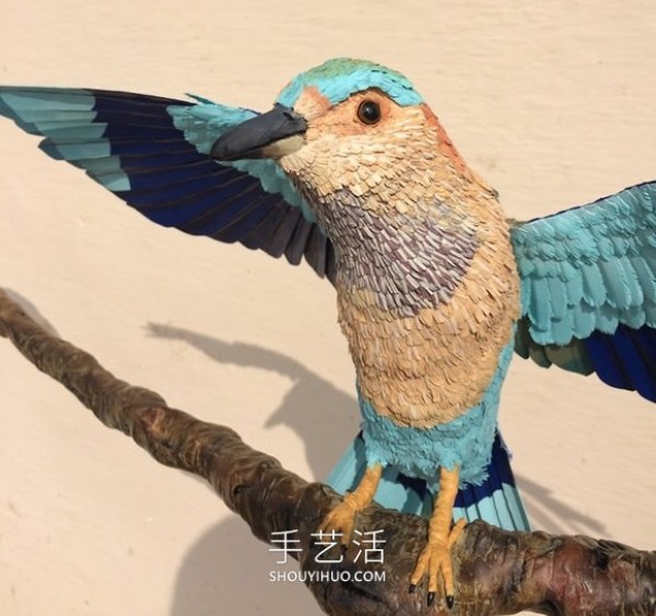 Realistic paper bird sculpture that looks like a photo