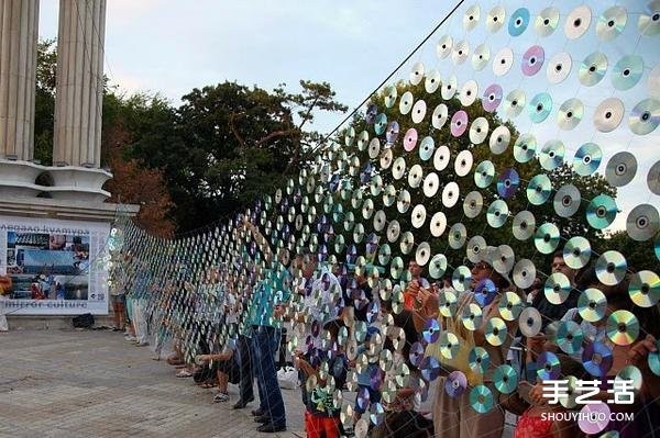 A giant rainbow curtain made of six thousand discarded CDs