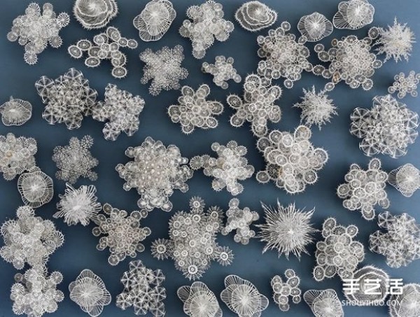 Three-dimensional paper sculptures inspired by bacteria, crystals, etc.