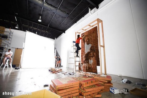 Twenty thousand tea bags create a large portrait of a "Teh Tarik Man" Like