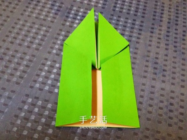 Detailed step-by-step illustration of a simple origami frog