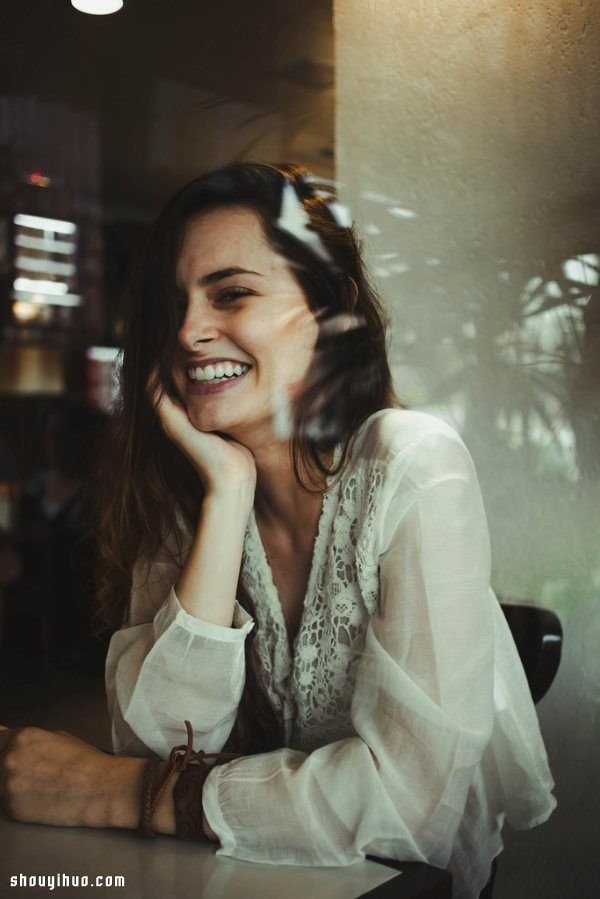 The girls reflection through the glass window takes a dreamy and beautiful photo