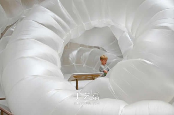 Low-tech power art installation giant insect-shaped plastic film sculpture