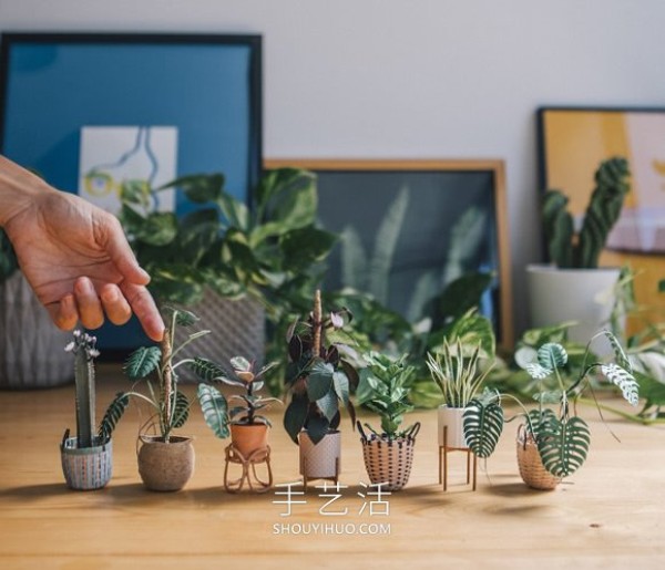 Amazing handmade paper potted plants that can be held between two fingers