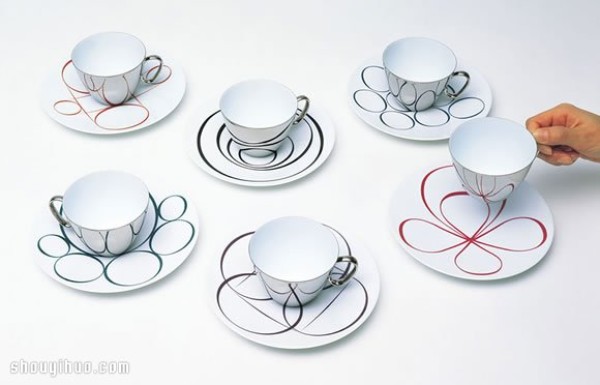 Waltz-like design of mirror-reflected coffee cups and trays of afternoon tea