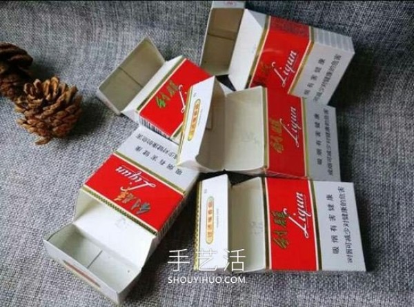 Empty cigarette box wastes are used to make handmade flower ashtrays/trash boxes