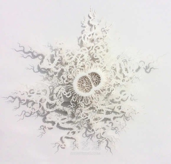 Intricate hand-cut paper sculptures that mimic microorganisms