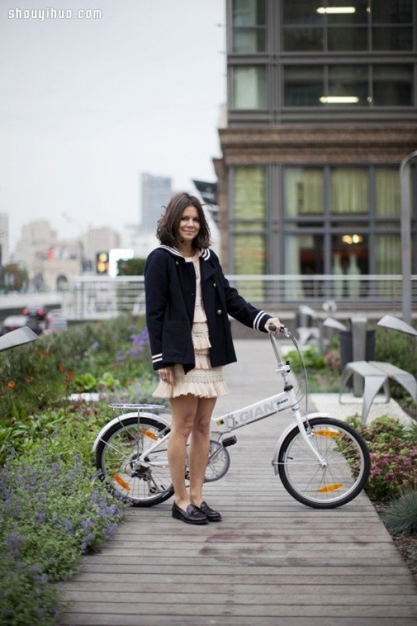 Moscows stylish bicycle girl travels elegantly in the urban area