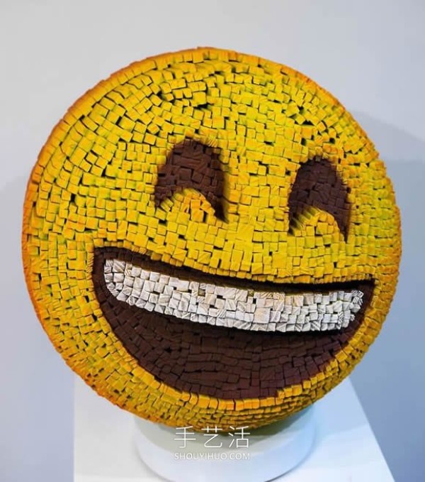 Vibrant pixelated wood carvings show the depth of the human soul