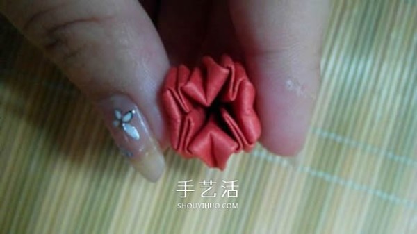 Illustration of the origami method of a lotus that is about to fully bloom