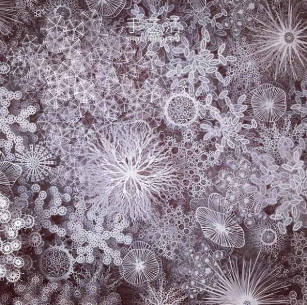 Intricate hand-cut paper sculptures that mimic microorganisms