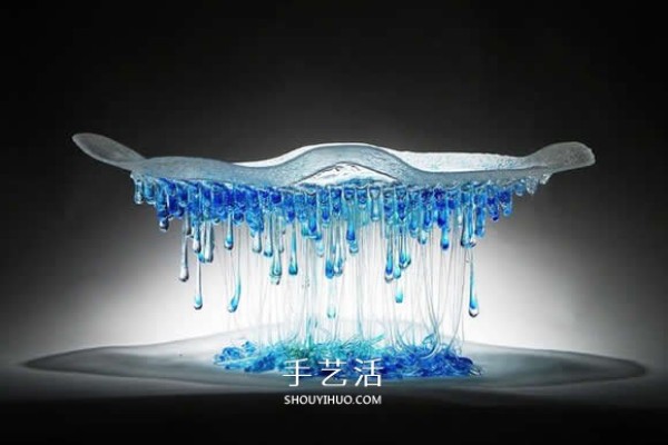 The dripping stained glass sculpture transforms into a jellyfish-like splendid gesture