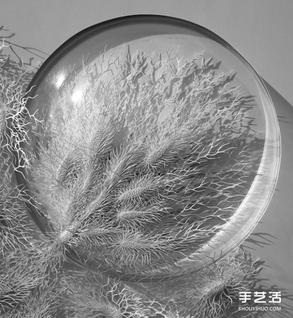 Three-dimensional paper sculptures inspired by bacteria, crystals, etc.