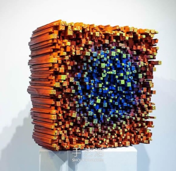 Vibrant pixelated wood carvings show the depth of the human soul