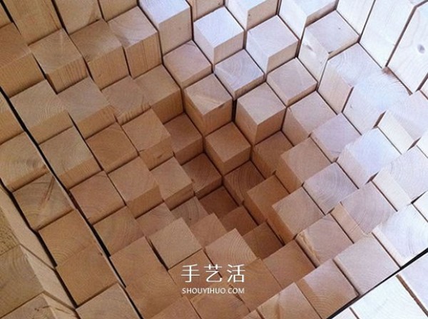 3000 wooden blocks to make a "trap" that swallows the floor