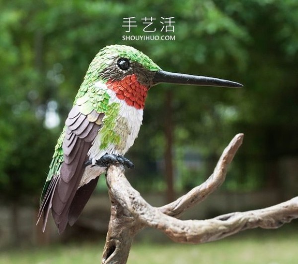 Realistic paper bird sculpture that looks like a photo