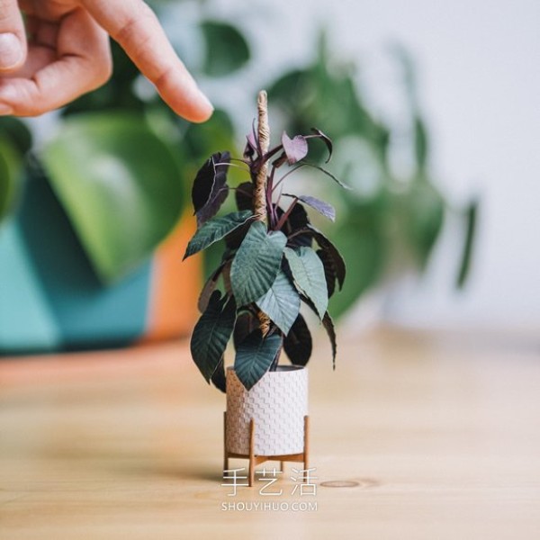 Amazing handmade paper potted plants that can be held between two fingers