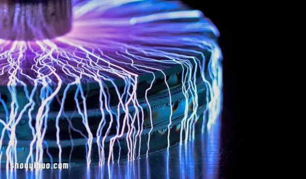 Photography of a perfect storm of artificial lightning under a Tesla coil