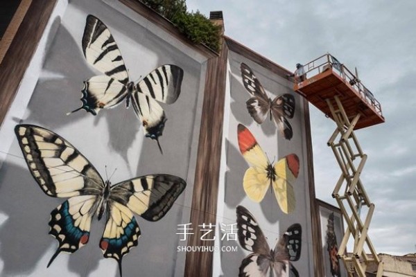 Giant wall graffiti turned the entire apartment wall into butterfly specimens