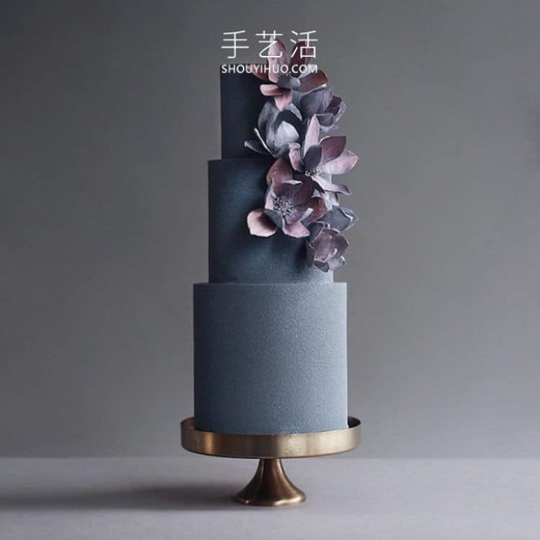 Towering creative cake that looks like an avant-garde sculpture in a museumSculpture