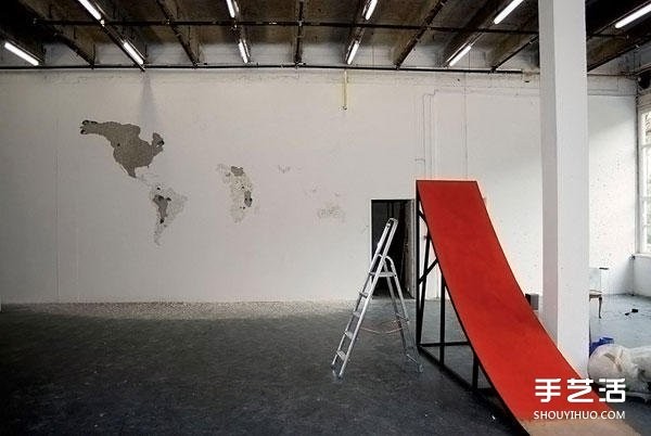 On a blank wall, DIY on a blank wall and tap on a whole side of the world map