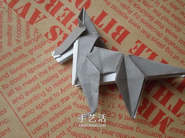 Illustrations of how to fold a cute puppy. Step-by-step pictures of origami puppies.