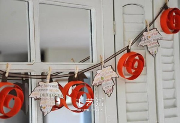 Handmade pumpkins and leaves from cardboard are made into beautiful Halloween decorations