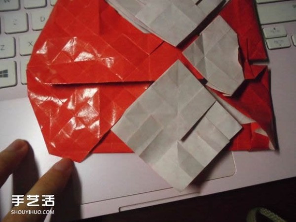 Illustration of origami kissing fishs heart. The process of folding a super complex heart.